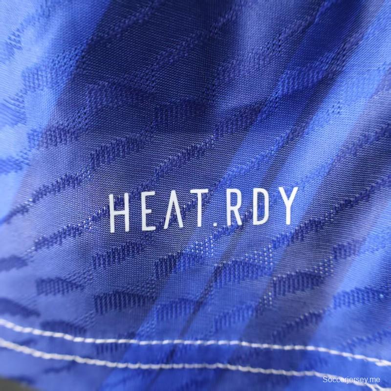 إصدار اللاعب 25/26 قميص ريال مدريد 25/26 إصدار محدود باللون الأزرق والبرتقالي بنقشة مجردة