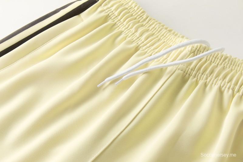 2026  سترة بأزرار كاملة + بنطال طويل من Adidas بلون المشمش